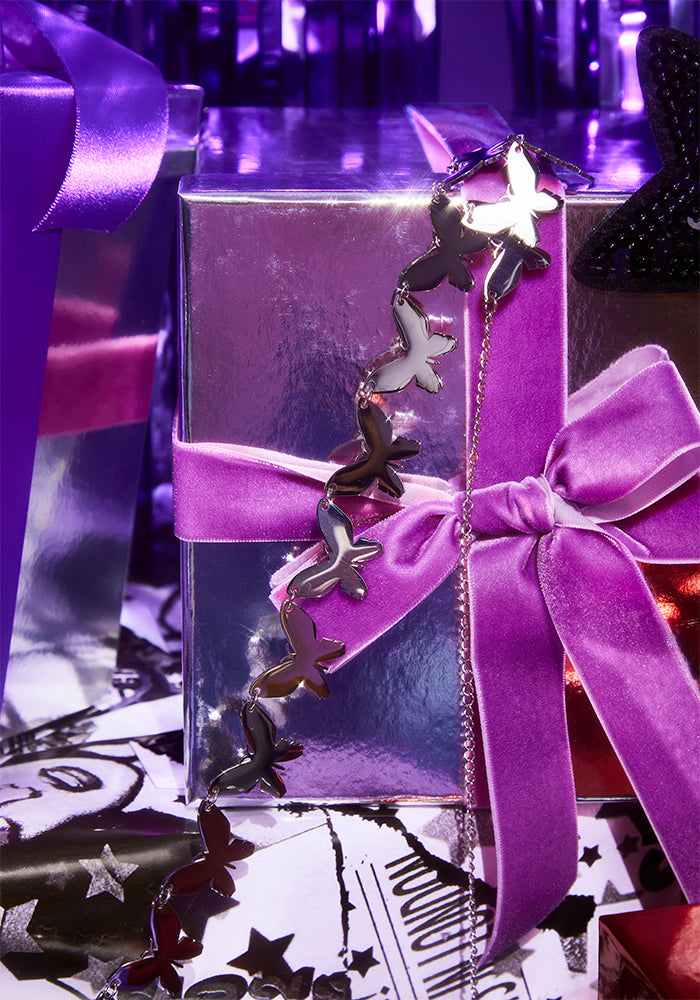 silver butterfly belt on gift box